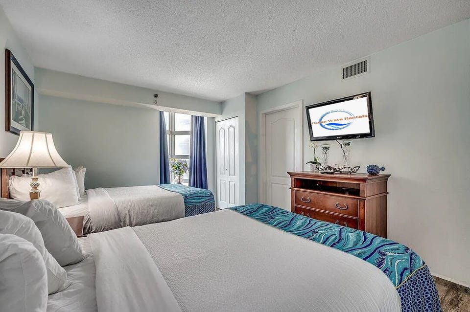 Modern room with two queen beds, ideal for friends or family stays