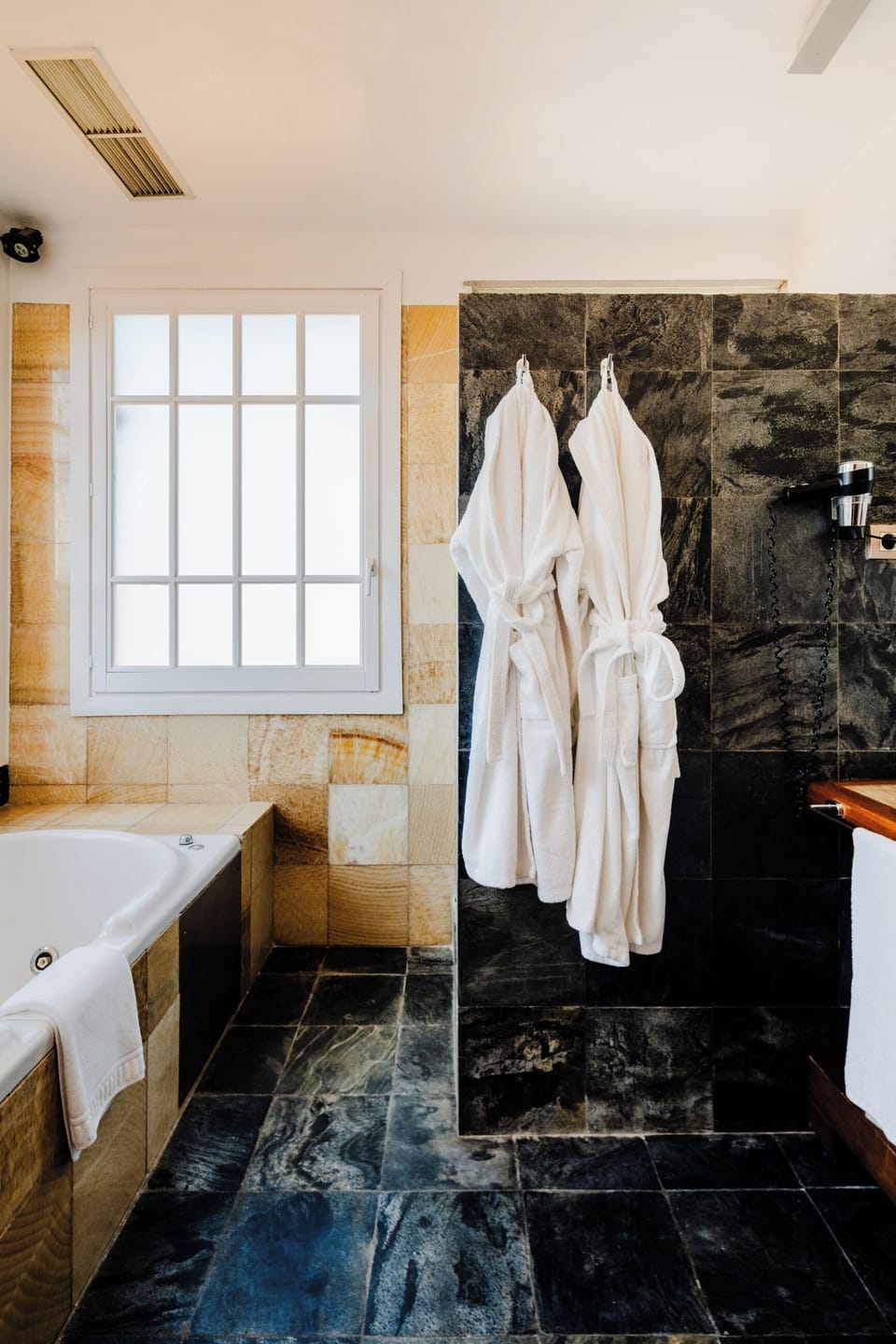 Combined shower/tub, designer toiletries, hair dryer, bathrobes