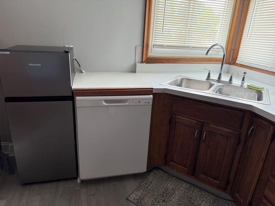 Fridge & Washer by the kitchen sink. 