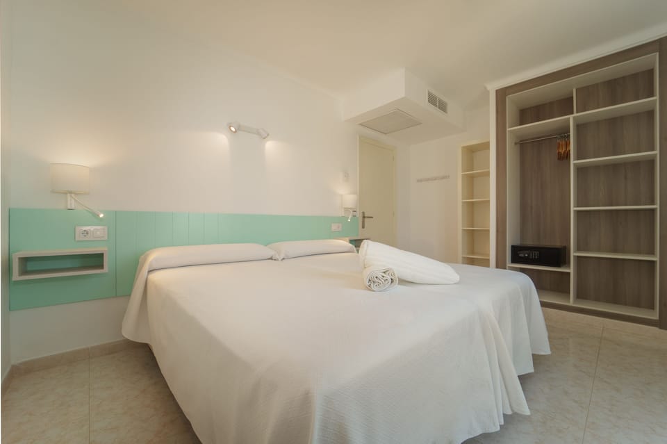 Apartment, 1 Bedroom, Balcony | 1 bedroom, desk, blackout drapes, iron/ironing board