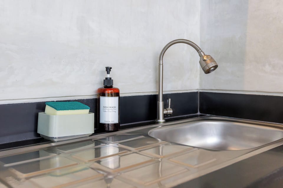 Villa | Private kitchen | Microwave, electric kettle, cookware/dishes/utensils, dining tables