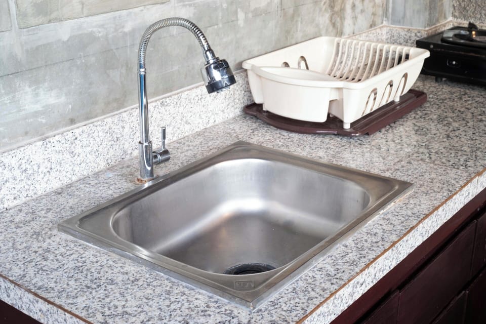 Microwave, electric kettle, cookware/dishes/utensils, dining tables