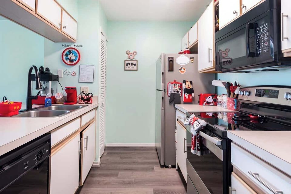 Our Kitchen includes Oven, Refrigerator, Microwave, and dishwasher.  Also, many plates, glasses, silverware, a coffee maker, toaster and enough utensils for you to craft your favorite Mickey dish!