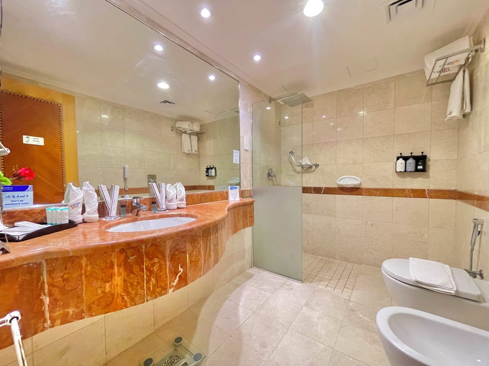 Hair dryer, slippers, towels, soap