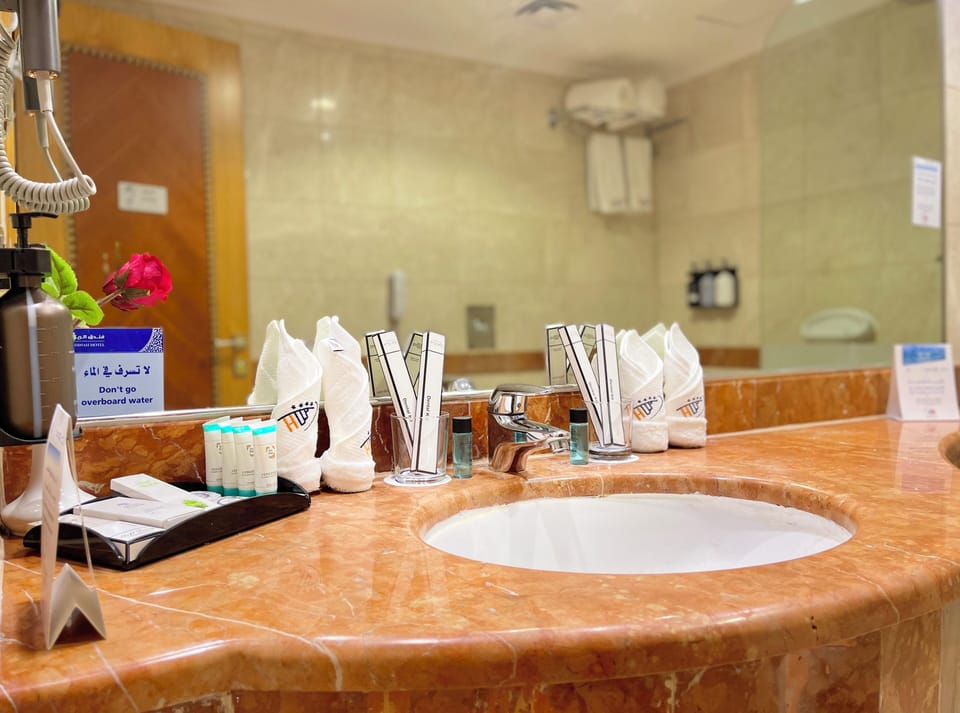 Hair dryer, slippers, towels, soap