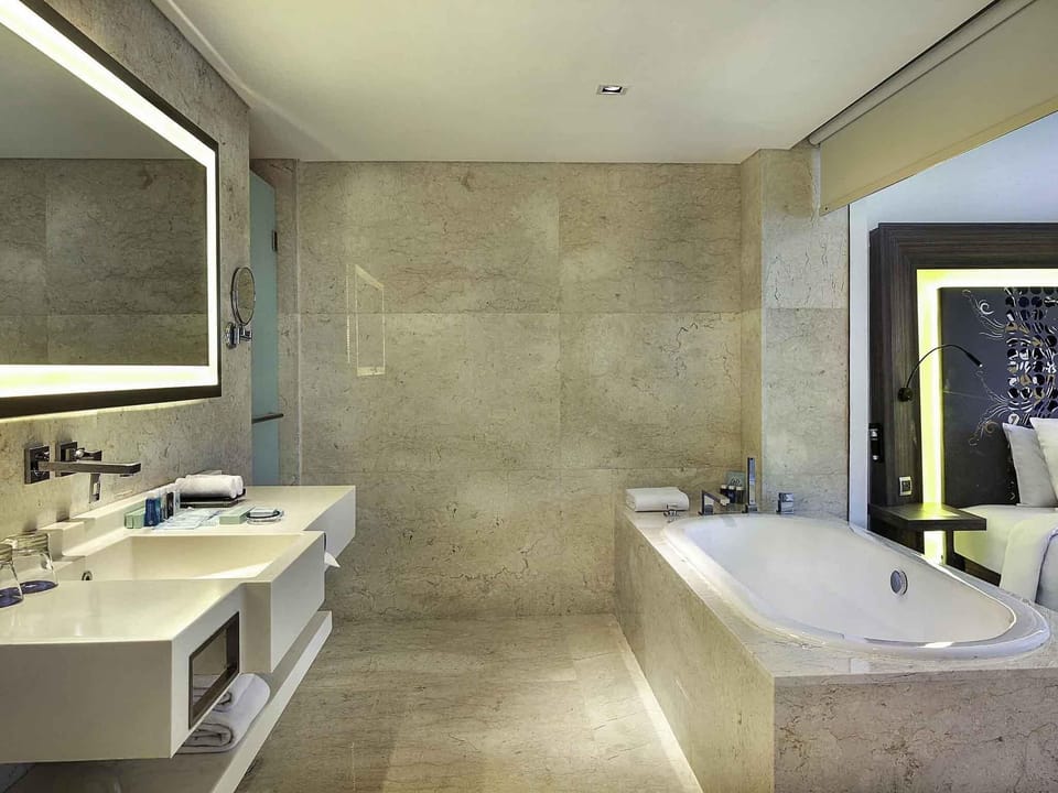 Suite, 1 Double Bed with Sofa bed (Free Access to Premiere Lounge) | Bathroom | Rainfall showerhead, eco-friendly toiletries, hair dryer, slippers