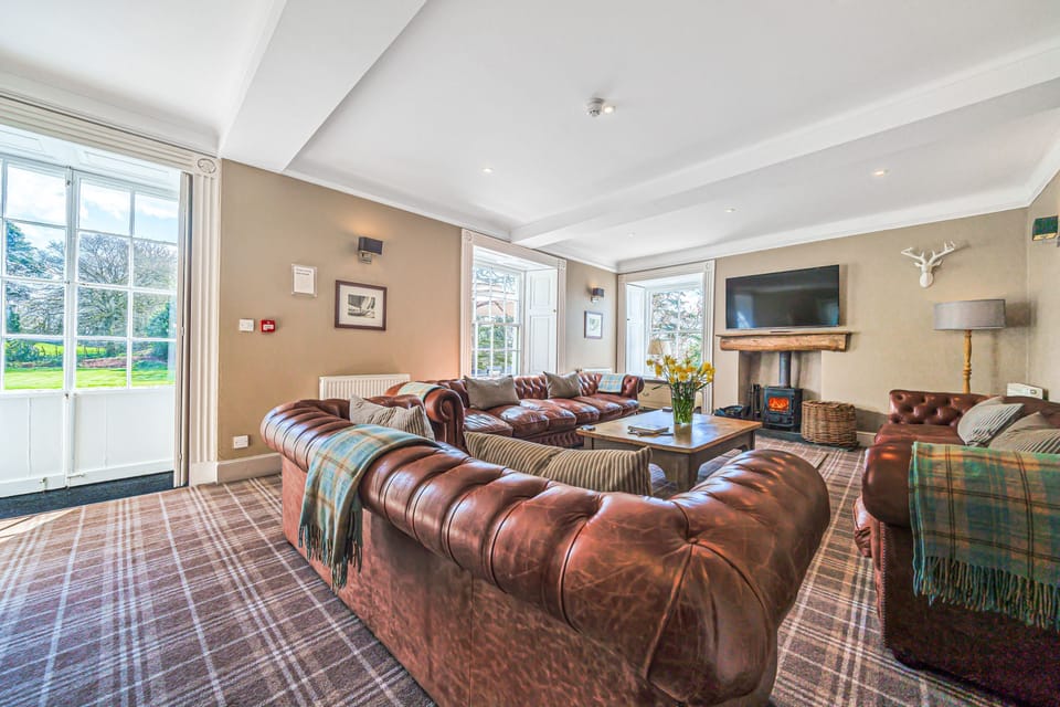 Grand lounge with lather Chesterfields for up to 18 guests.