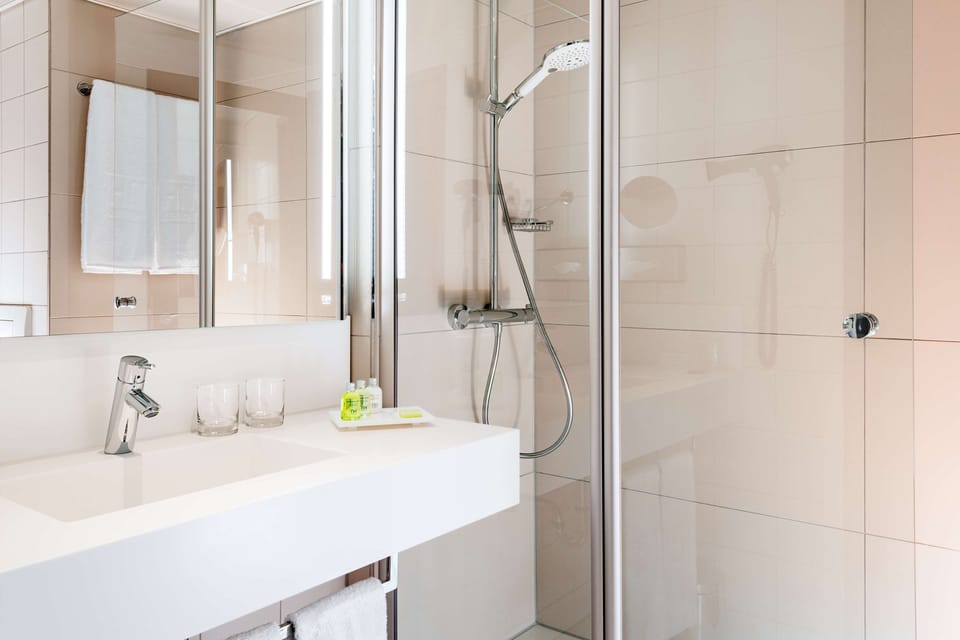 Bathtub, eco-friendly toiletries, hair dryer, towels