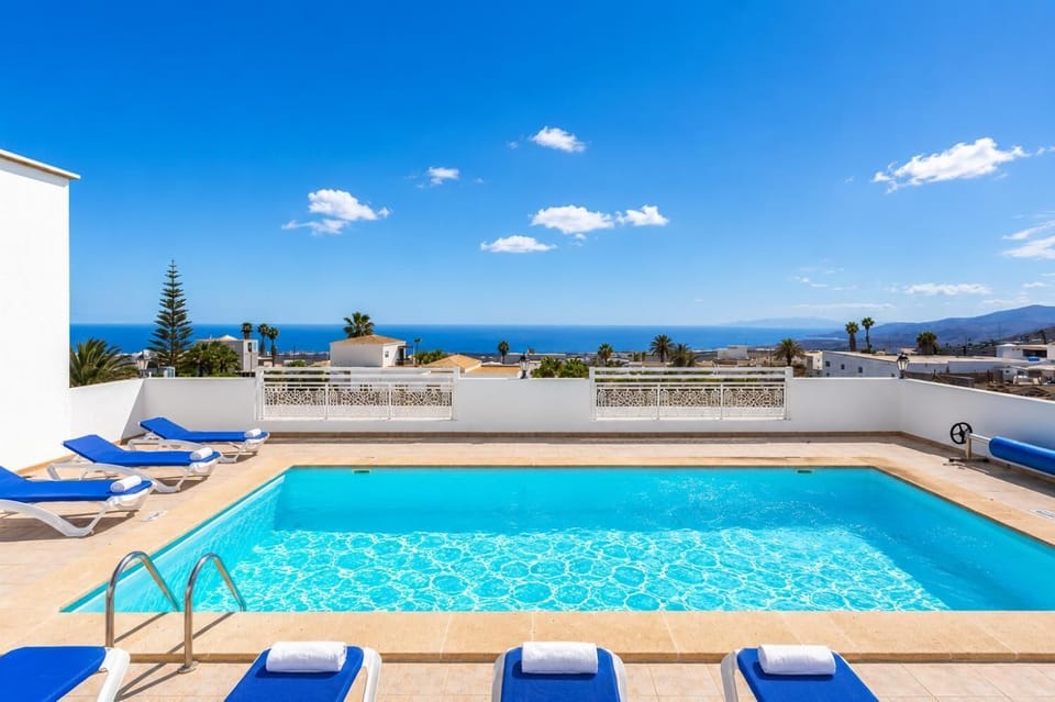 Private pool, terrace, and garden with sea views