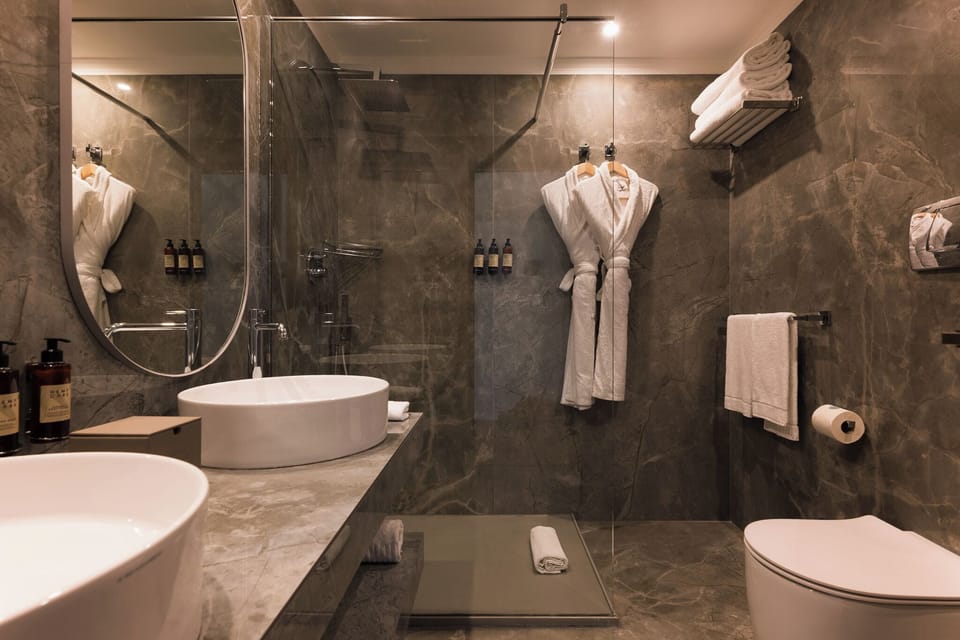 Designer toiletries, hair dryer, bathrobes, slippers