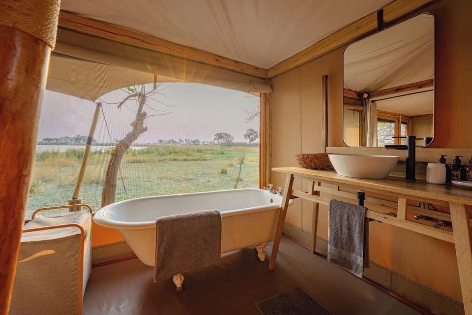 Luxury Tent, Multiple Beds, Lakeside | Bathroom | Shower, rainfall showerhead, free toiletries, towels