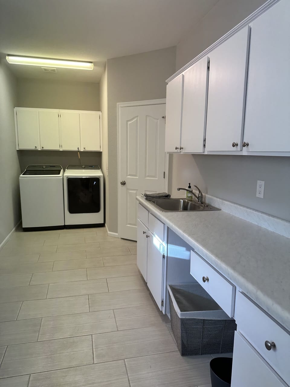 Huge Laundry/Craft Room with full size washer and dryer.