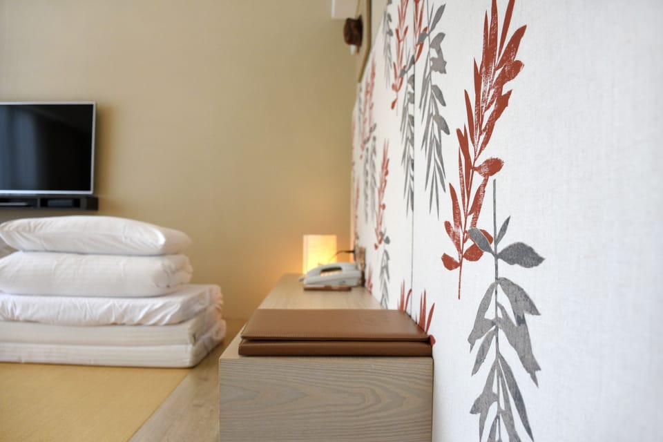 Japanese-style Triple Room | Desk, blackout drapes, iron/ironing board, free WiFi