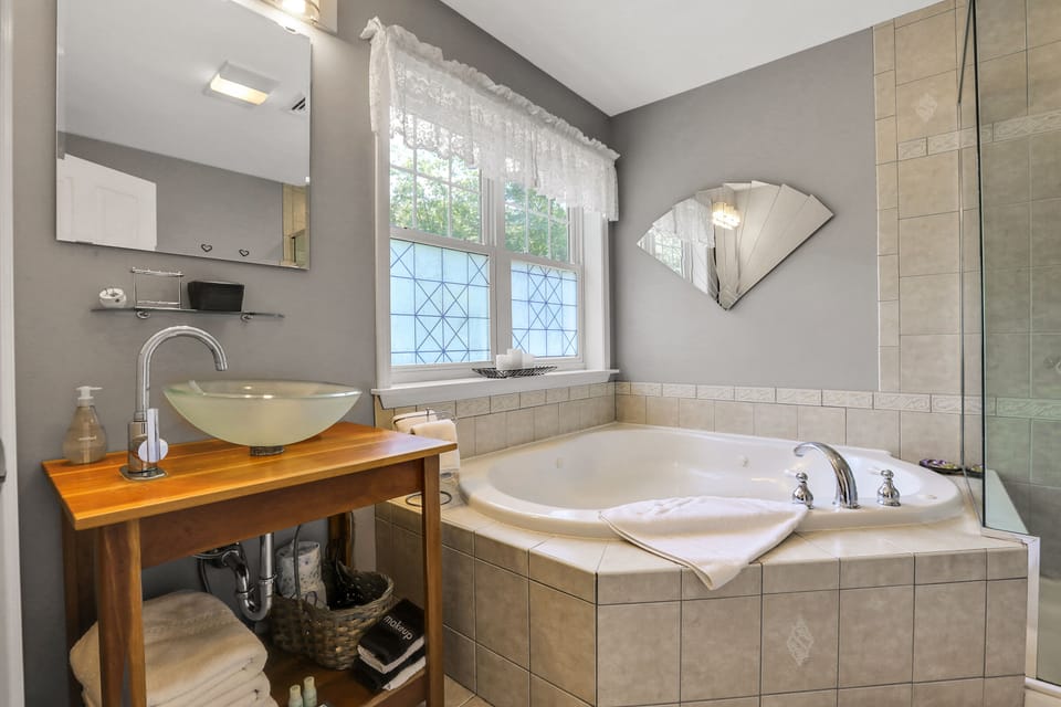 #5-Moondance Suite | Bathroom | Combined shower/tub, jetted tub, hair dryer, bathrobes