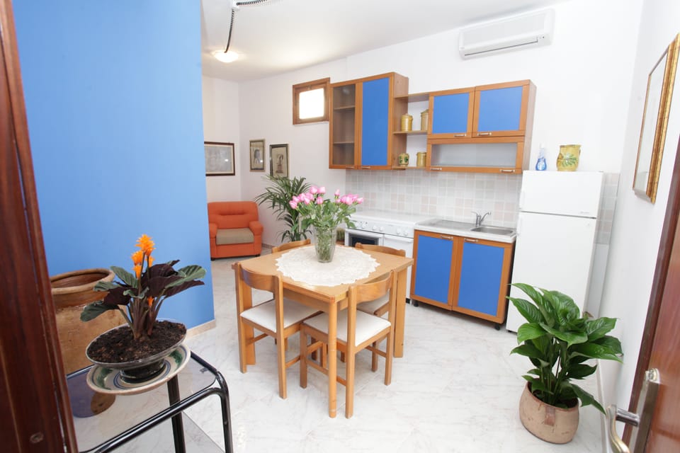 Family Room, 2 Bedrooms, City View | Private kitchenette | Full-size fridge, stovetop, cookware/dishes/utensils