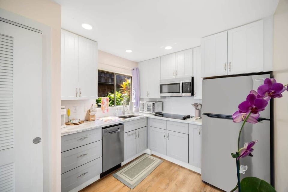 Culinary haven awaits! Our kitchen is stocked to perfection, inviting you to whip up your favorite meals with ease and joy