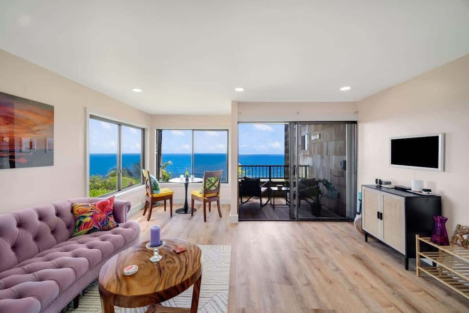 Oceanfront serenity! Relax on the comfy couch, enjoy your favorite show on tv, and soak in the beauty of unobstructed ocean views