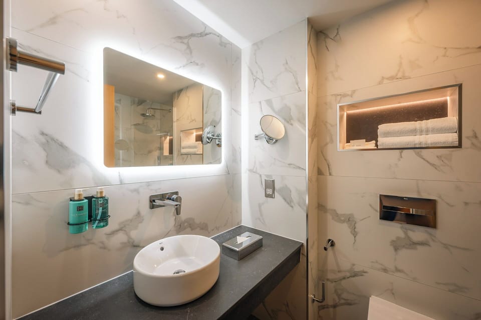 Designer toiletries, hair dryer, towels