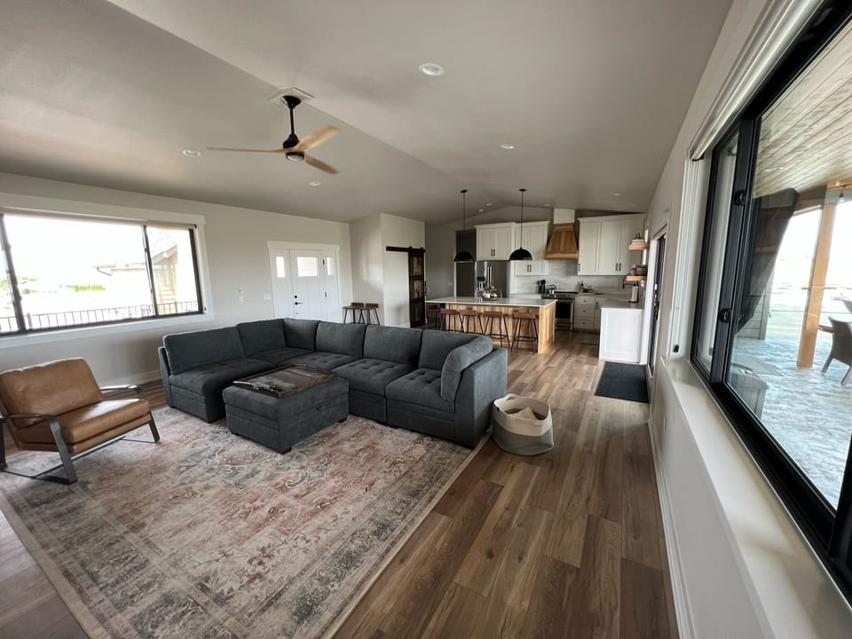 Great room with comfortable sectional and TV