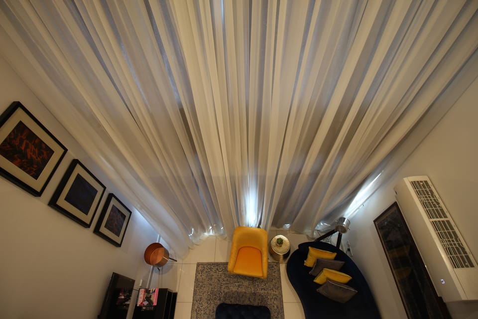 Deluxe Duplex | Living area | Flat-screen TV