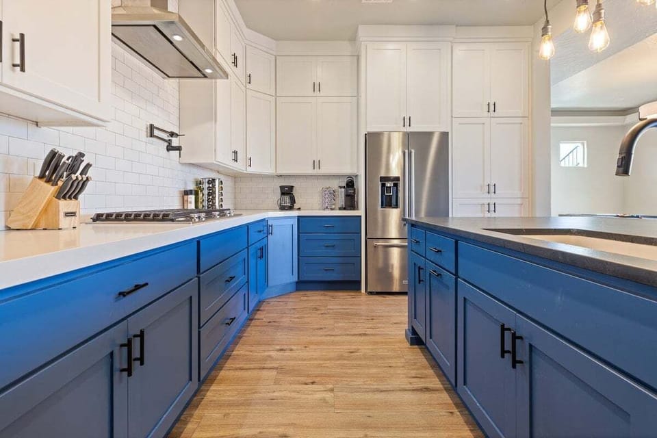 This kitchen is thoughtfully equipped with all the essentials for cooking, featuring modern appliances, ample counter space, and a full range of cookware and utensils.