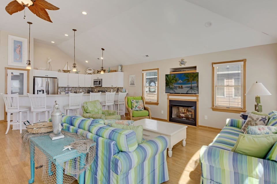 Open-concept living space ideal for gathering. (Note: Fireplace is NOT available for guest use.)