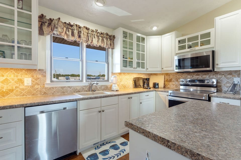 Whip up something delicious in the large Kitchen with updated appliances and plenty of prep space.