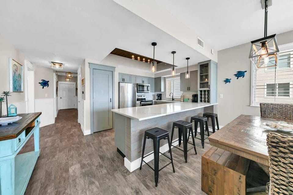 There is 4 Bar Seats at the Kitchen Breakfast Bar