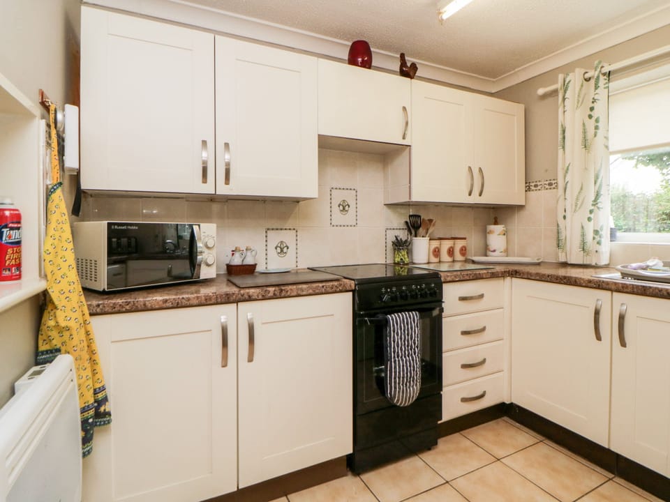 Fridge, electric kettle, toaster, cookware/dishes/utensils