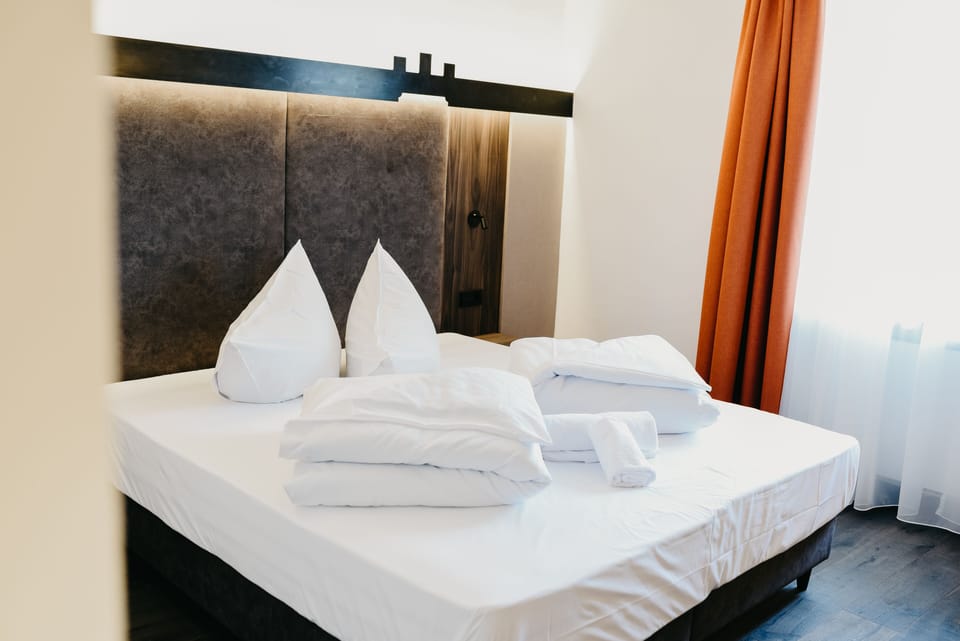 Double Room (Zwölferturm) | In-room safe, desk, laptop workspace, blackout drapes