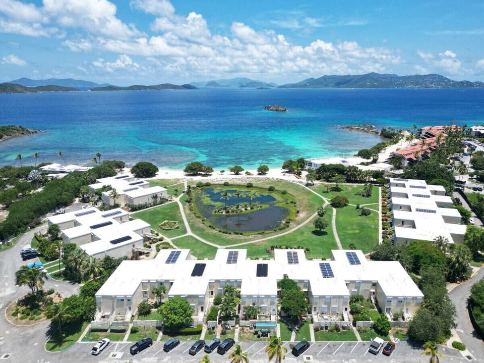 Set within a secure gated community, enjoy private beach access and stroll to nearby beachside dining—all just steps from your island home.