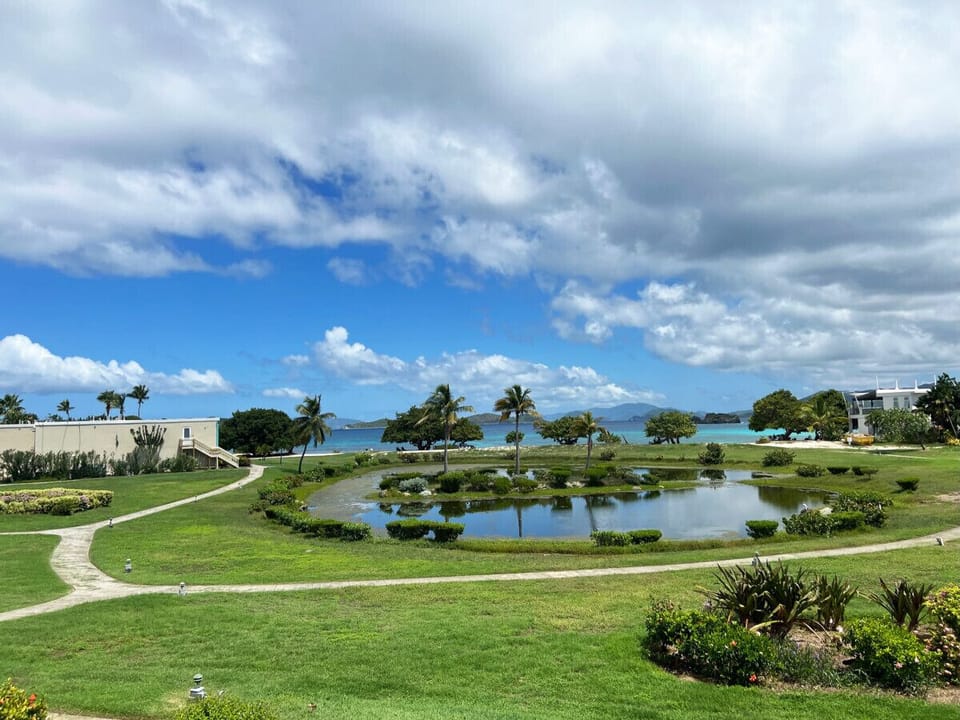 Enjoy a leisurely walk through the lush, well-kept grounds that frame your island retreat.
