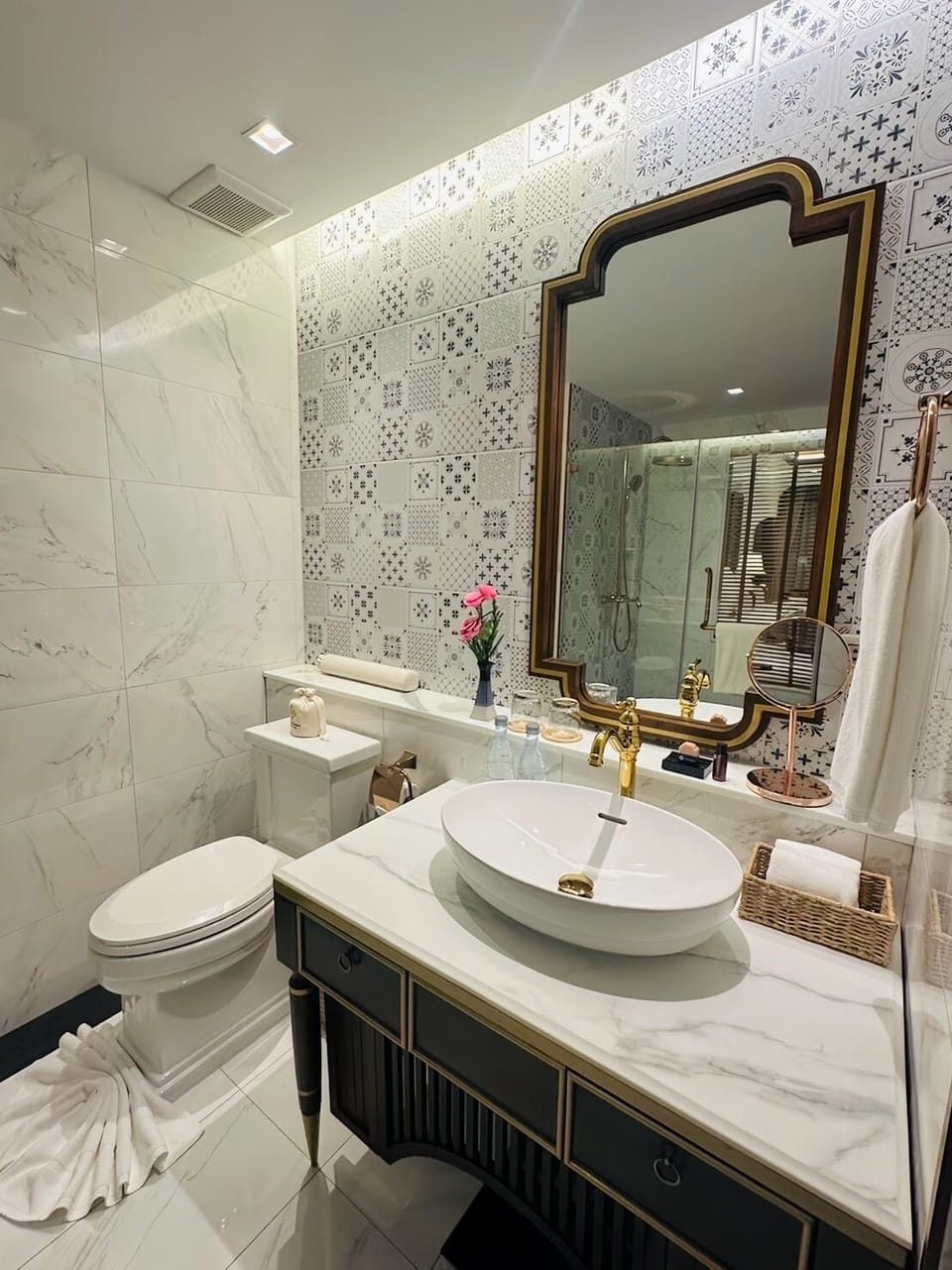 Separate tub and shower, rainfall showerhead, free toiletries
