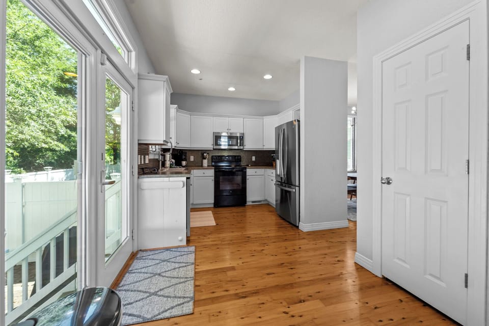 Kitchen Area on First Level with Patio Access
