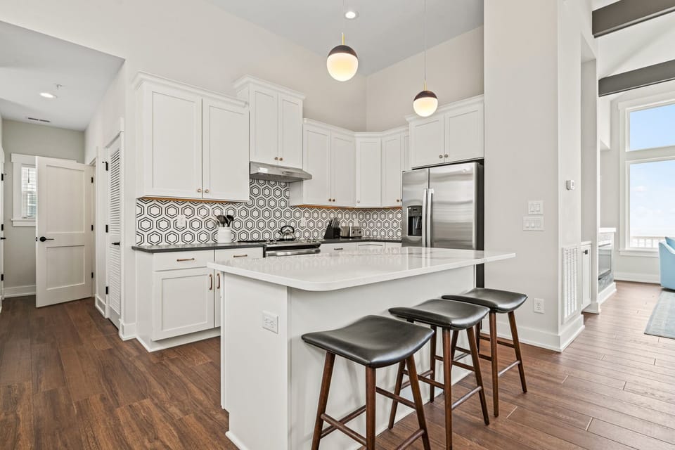 Kitchen with Bar Stool Seating on Third Level