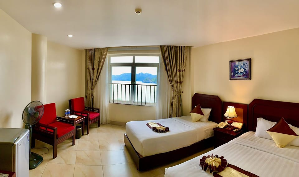Deluxe Room, Ocean View | Minibar, in-room safe, desk, laptop workspace