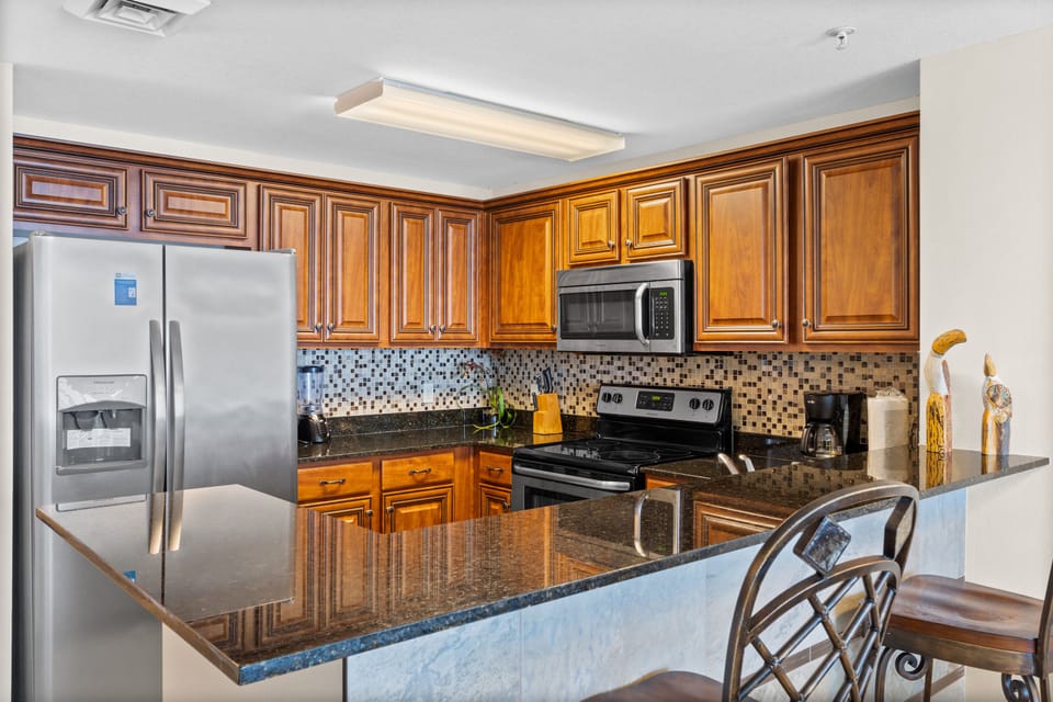 Kitchen - Prepare feasts with ease in this elegant kitchen, outfitted with top-notch appliances,and a full suite of cooking essentials.