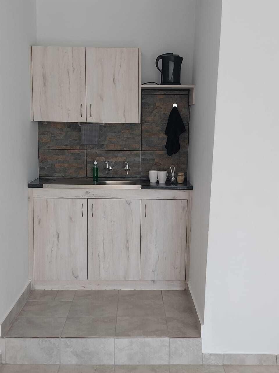 Classic Studio Suite, 1 Double Bed, Non Smoking, Mountain View | Private kitchen | Cookware/dishes/utensils, cleaning supplies, kitchen islands