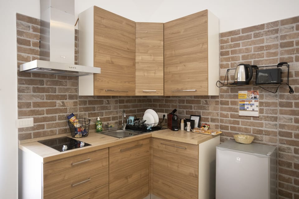 Comfort Condo | Private kitchen | Espresso maker, coffee/tea maker, electric kettle, dining tables