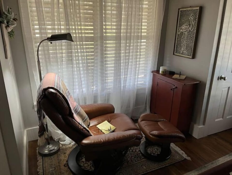 A comfy chair with light is perfect for reading, knitting, or napping!