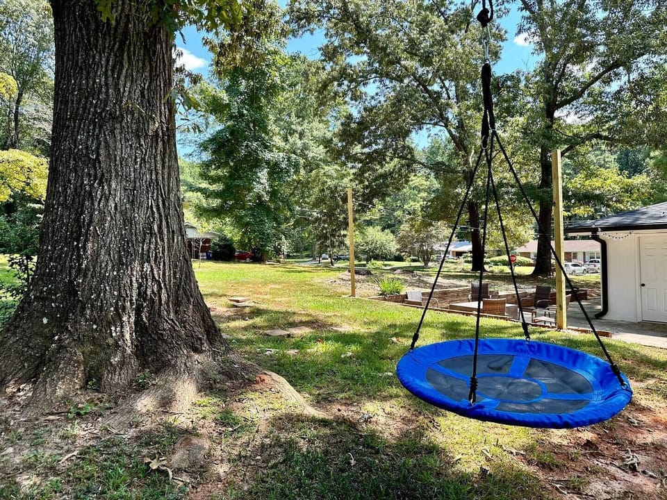 Make the most of outdoor living with a tree swing and ample space to roam.