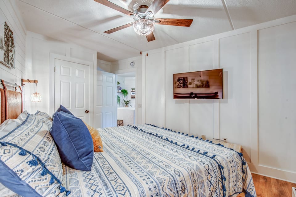 King Bedroom with tv and ceiling fan and own ac & heat unit 