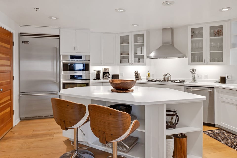 This single-level two bedroom condo offers guests a beautiful open kitchen with spacious living and dining area, private decks surrounding the unit and shared hot tub area.