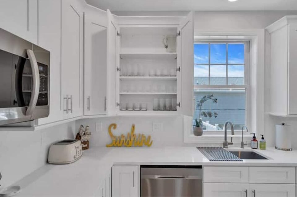 Kitchen stocked with glassware.