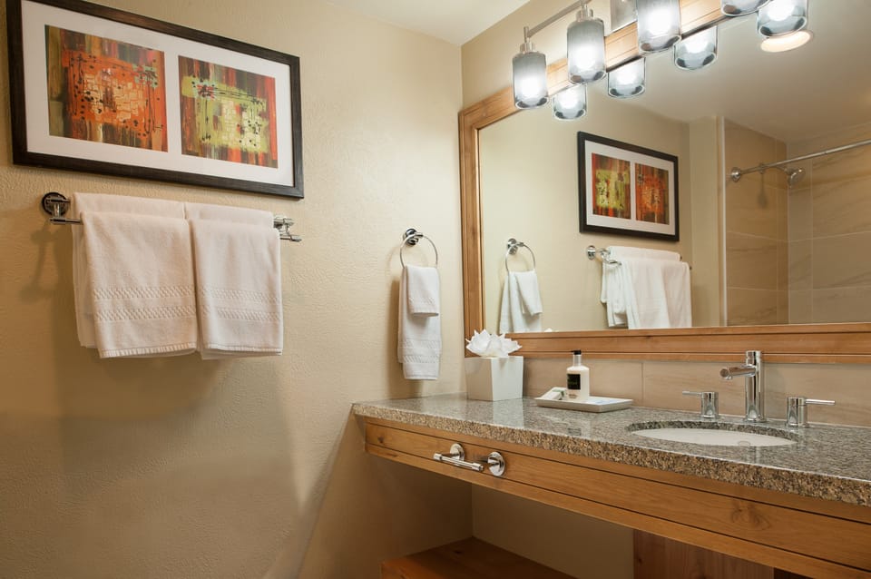Prepare for the day ahead in the bright and modern bathroom.