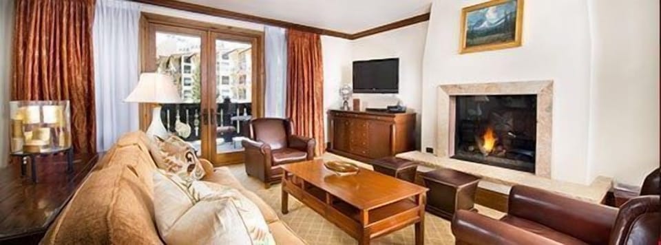 Cozy up in front of the fireplace after a long day on the slopes.