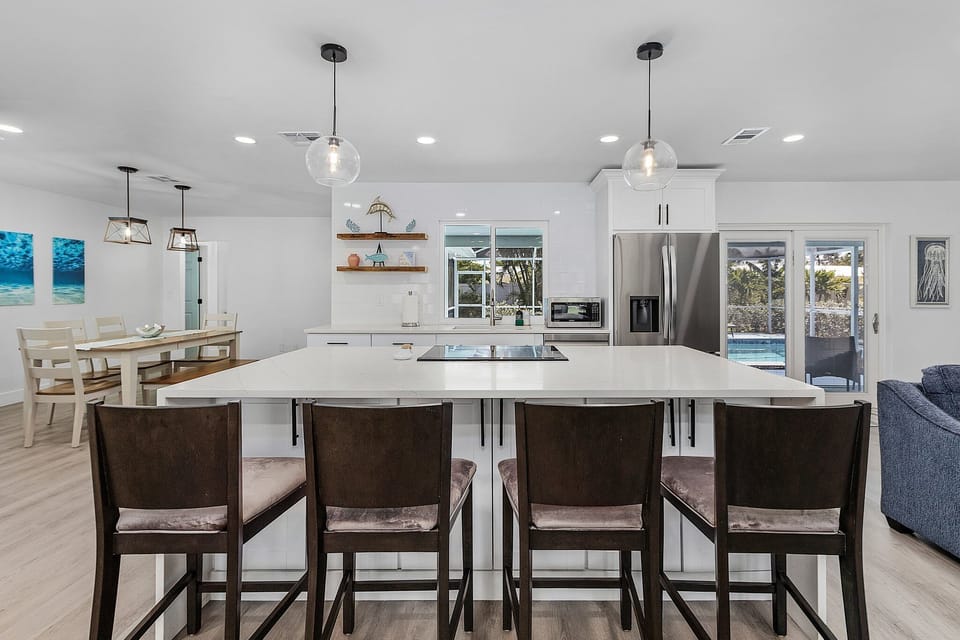 Large center island and stools for additional seating.