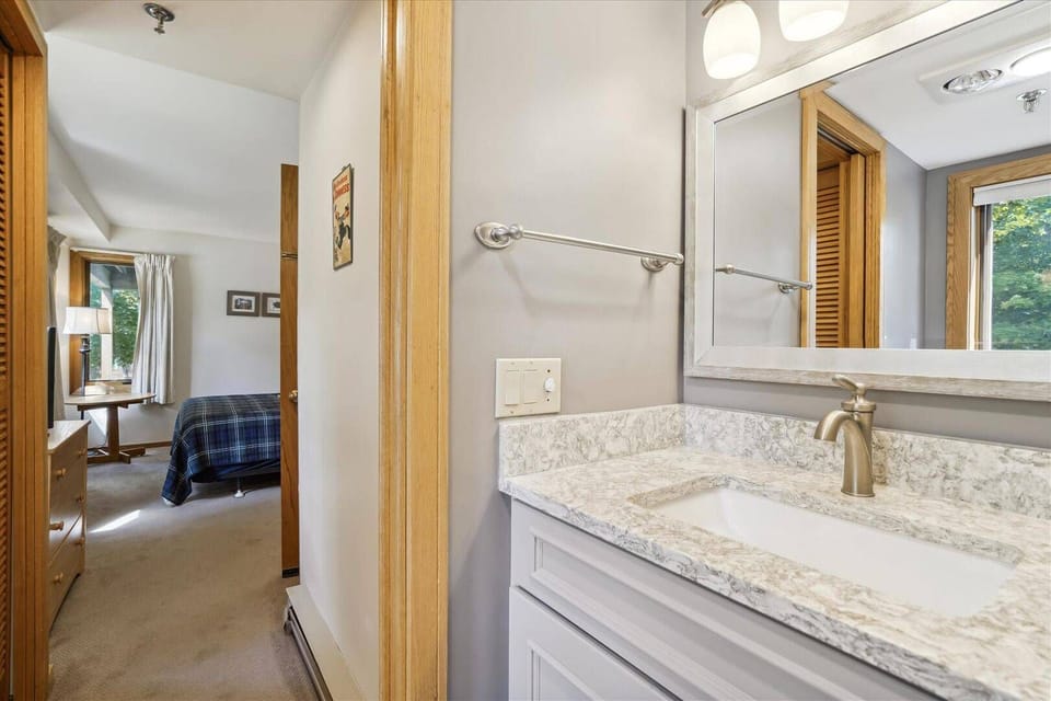Updated Bathroom Vanity - A modern vanity with plenty of counter space makes getting ready easy.