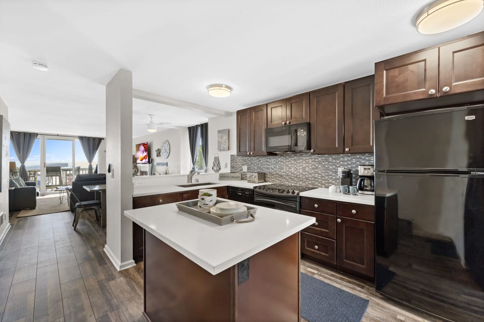 Cook up your beachside culinary creations in style with this kitchen, complete with custom cabinets, granite countertops, and everything you need for a gourmet meal.