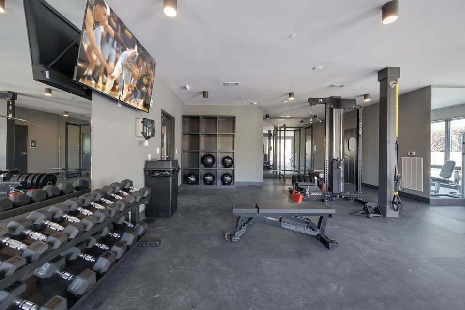 Communal Area: Gym offering a wide range of workout equipment, and a Smart TV.